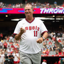 Patient smiling at the stadium after recovery from artificial disc replacement Germany